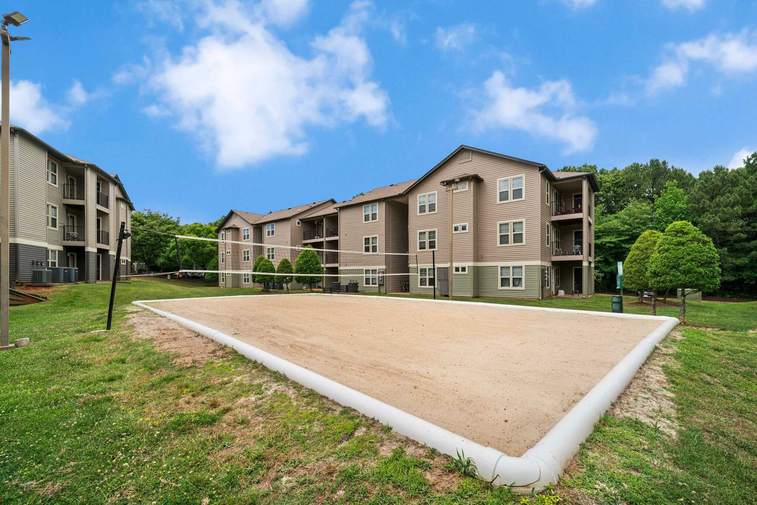 Apartment courtyard with sand volleyball pit